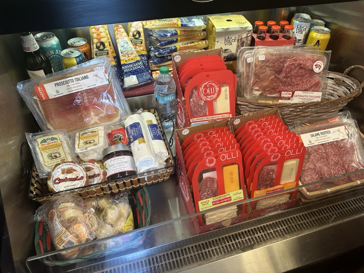 The deli case with Italian salumi, cheeses and specialty foods